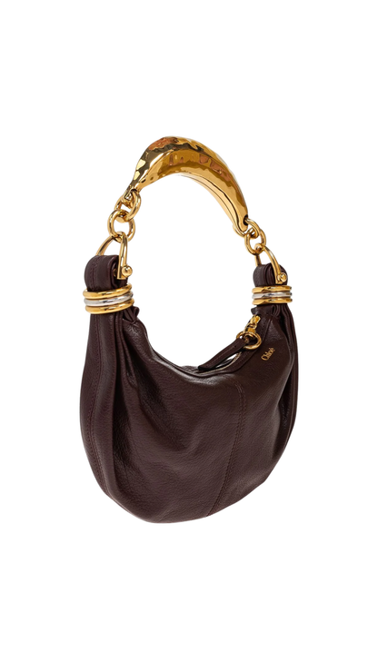 Minibolso de pulsera en color granate
